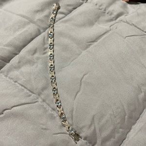 Diamond, silver, & blue topaz bracelet.